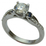 Custom Diamond Solitaire with pave and petite sapphire sides!